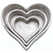 Set of three stone-effect ceramic heart dishes nested together