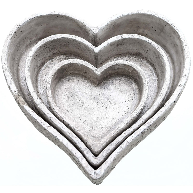 Set of three stone-effect ceramic heart dishes nested together