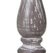 Close-up of the weathered grey-washed column