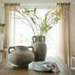 Large amphora with branches beside a pelike pot, sold separately