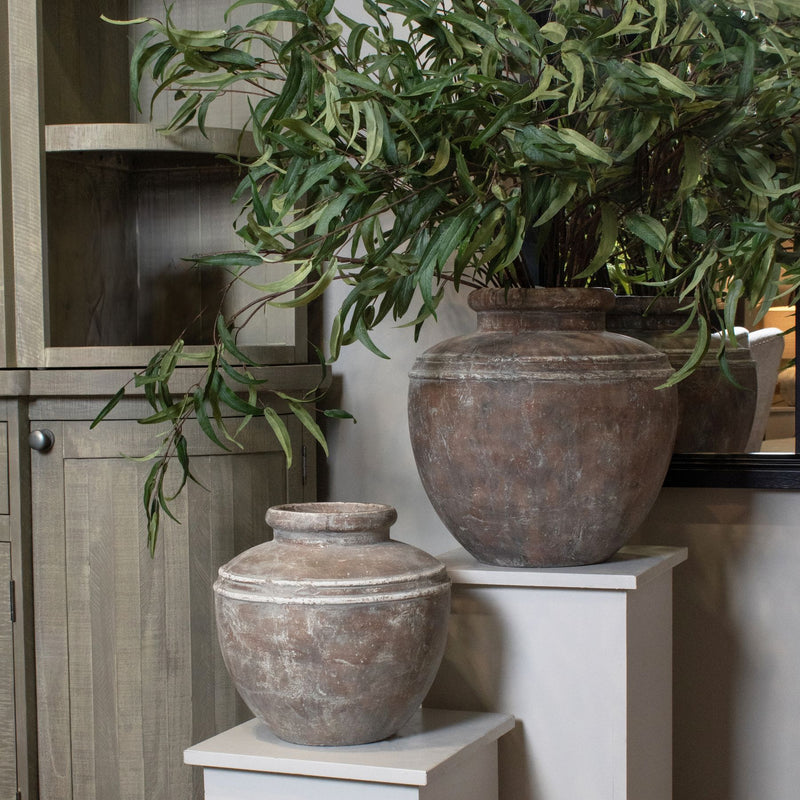 Siena water pots on plinths with greenery, shown with the larger size sold separately