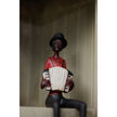 Accordion player figurine sitting on a shelf