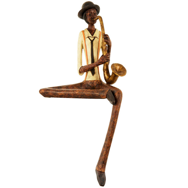Sitting jazz saxophonist figurine in a cream jacket on white
