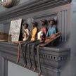 Jazz band figures lined up on a mantelpiece, others sold separately