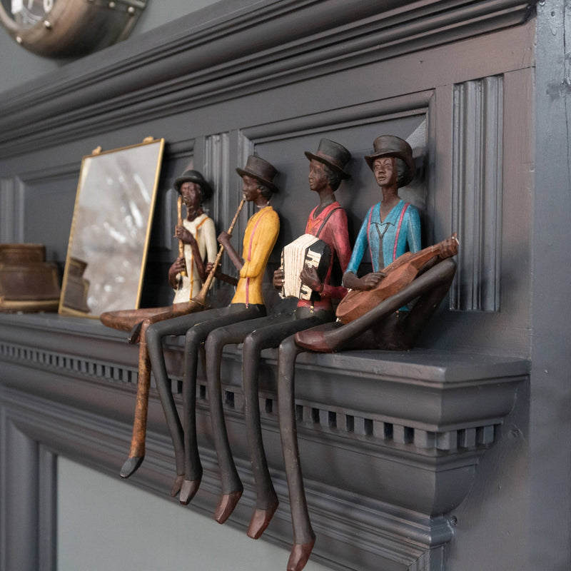 Jazz band figures lined up on a mantelpiece, others sold separately
