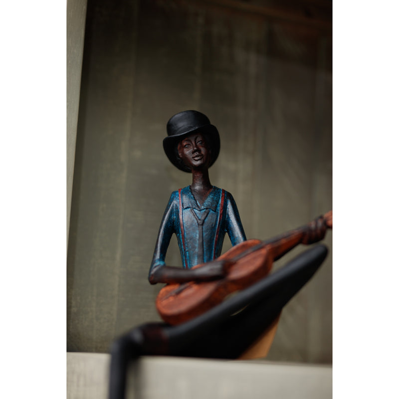 String player figurine sitting on a shelf ledge