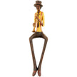 Sitting jazz trumpeter figurine in a mustard jacket on white