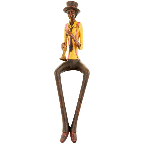 Sitting jazz trumpeter figurine in a mustard jacket on white