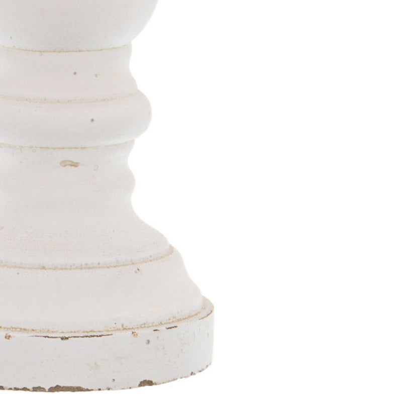 Close-up of the worn edges on the candle holder base