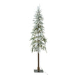 slim snowy woodland Christmas tree with lights on