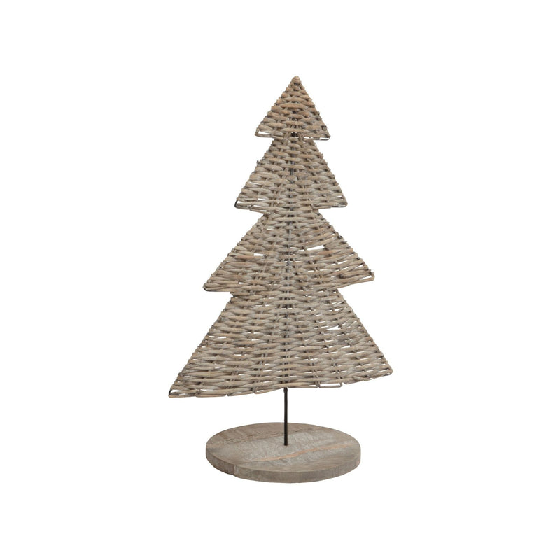 Small woven wicker Christmas tree on a round wooden base on white