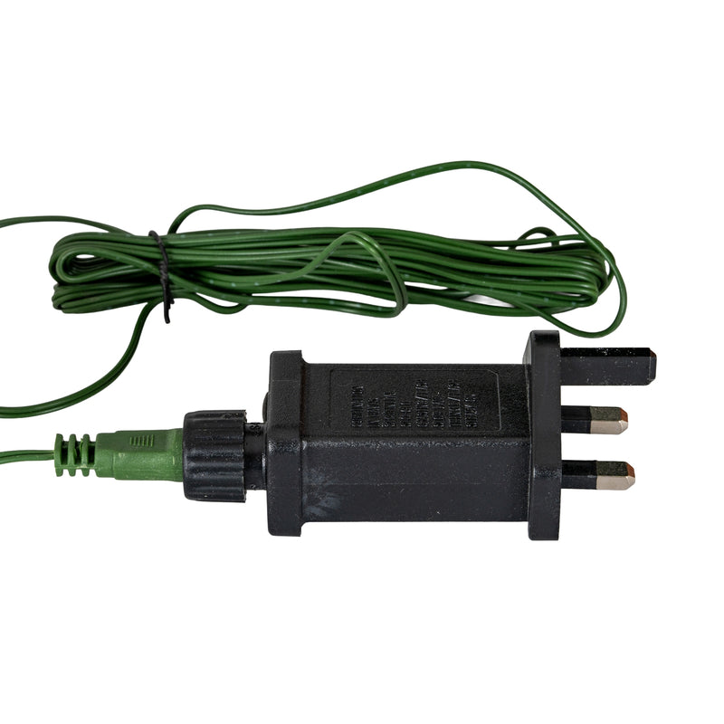 plug-in adaptor with UK three-pin plug and green cable