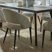 Sorelle chairs around a dark dining table