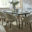 Sorelle chairs at a dining table by a window