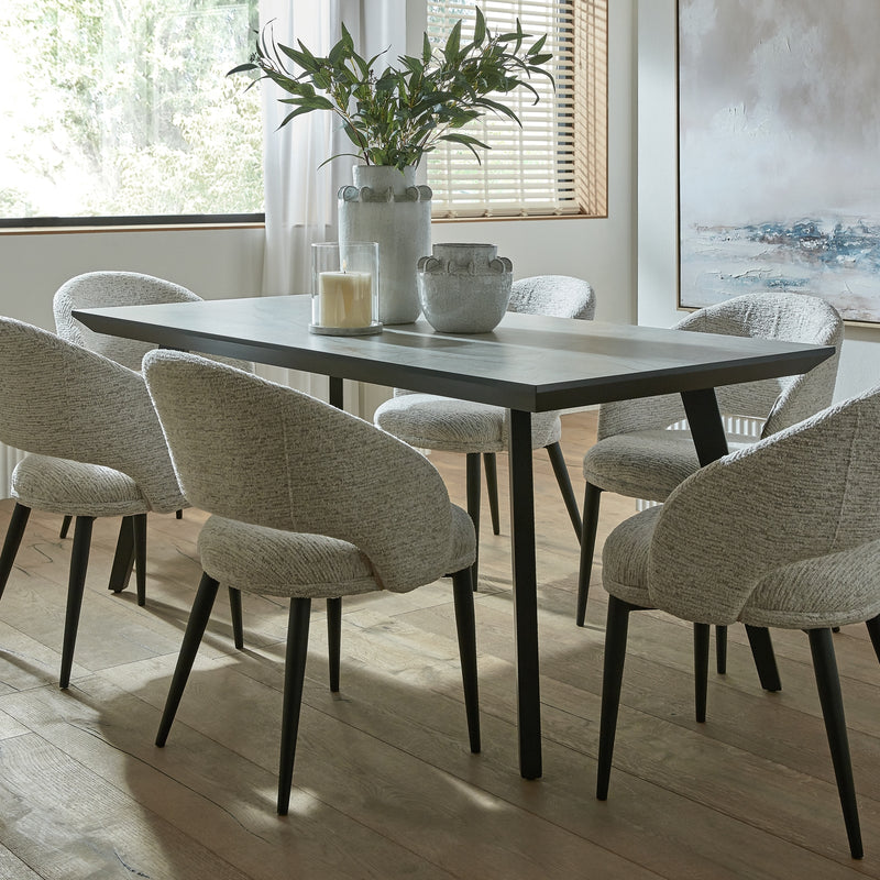 Sorelle chairs at a dining table by a window