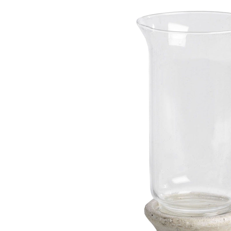 Close-up of the clear glass shade sitting on the stone base
