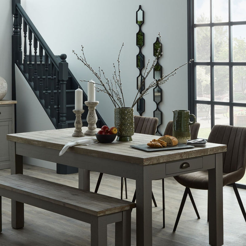 Stone-effect candle holders on a dining table