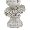 Close-up of the ruffle collar and pedestal base