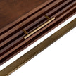 Close-up of the brass-tone bar handle and ribbed edge