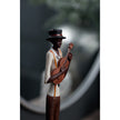 Close-up of the violinist figurine and instrument