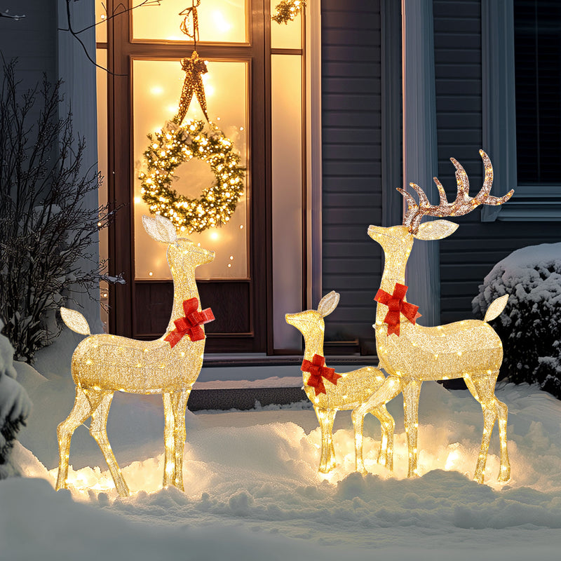 3-Piece Light-Up Reindeer Family illuminated outside a decorated home
