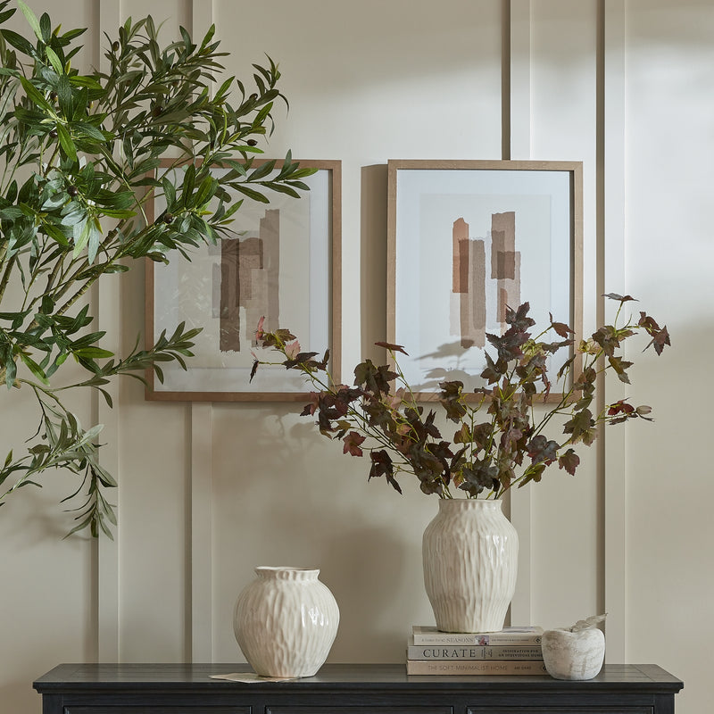 Terran art hung on a panelled wall beside a second abstract artwork sold separately