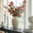 Thorne amphora vase with pink blooms on a console