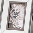 Close-up of the Tristan frame's bevelled mirror and wood edge