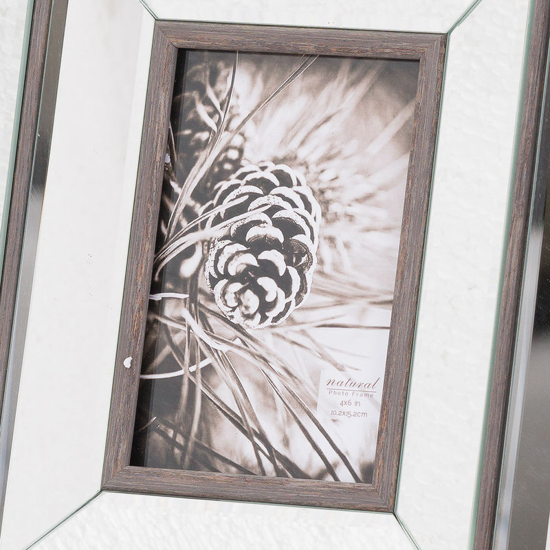 Close-up of the Tristan frame's bevelled mirror and wood edge