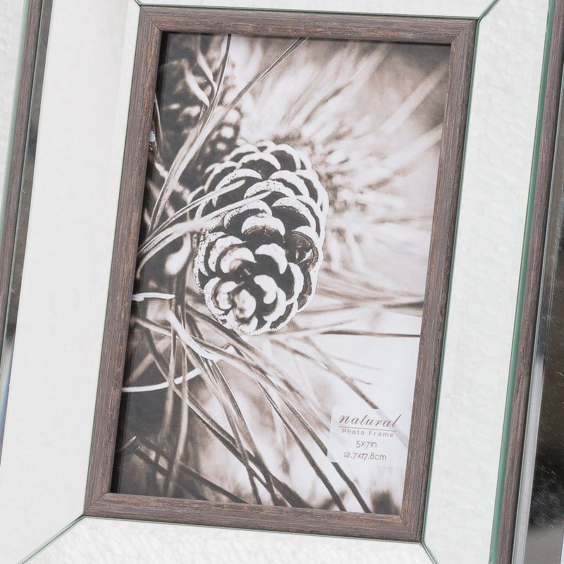 Close-up of the Tristan frame's bevelled mirror and wood edge