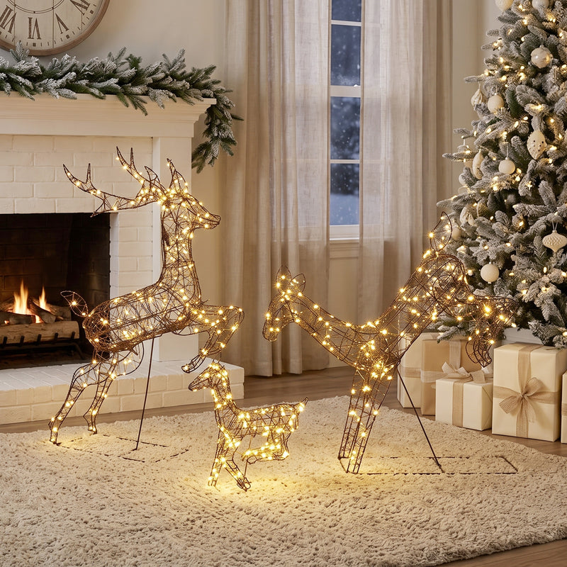 3-Piece Rattan Reindeer Family illuminated in a room