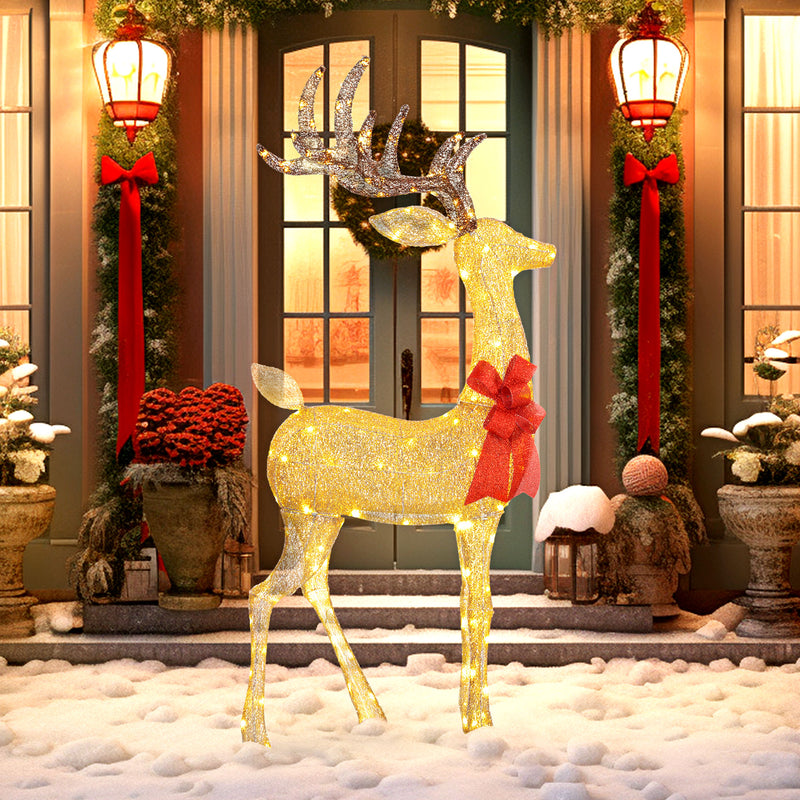 Light-Up Christmas Reindeer Decoration illuminated outside a decorated home