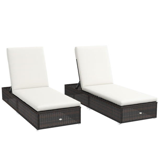 Two brown rattan sun loungers with cream padded cushions and reclining backs