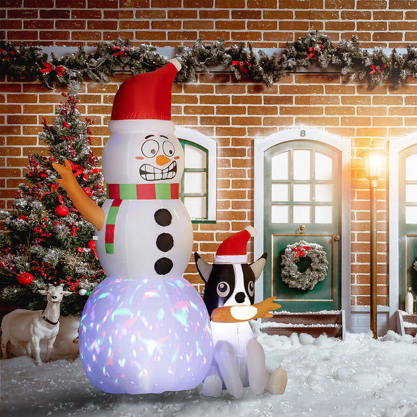 6.2ft Snowman and Dog Christmas Inflatable displayed outside a decorated home