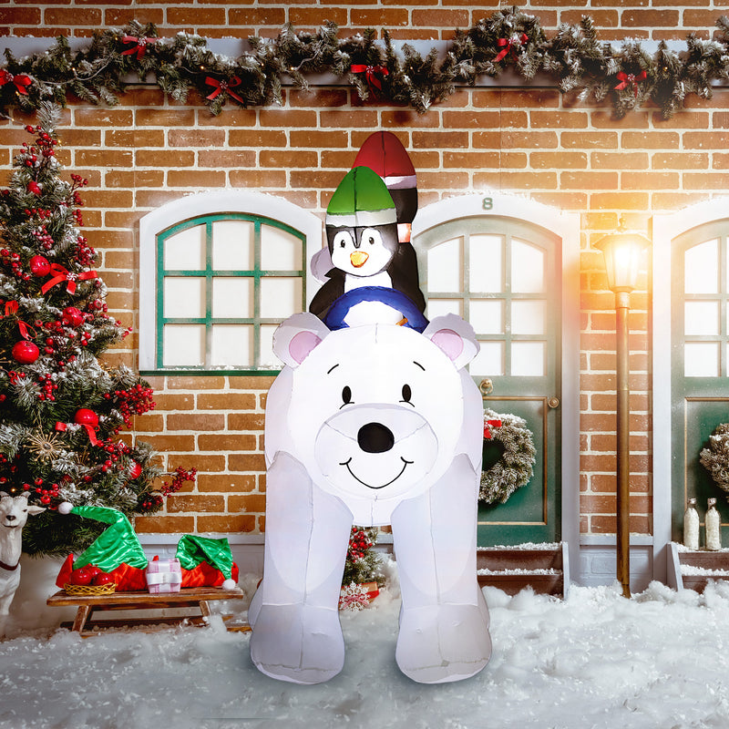 6.4ft Polar Bear and Penguins Christmas Inflatable displayed outside a decorated home