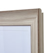 Close-up of the whitewashed stepped wooden moulding