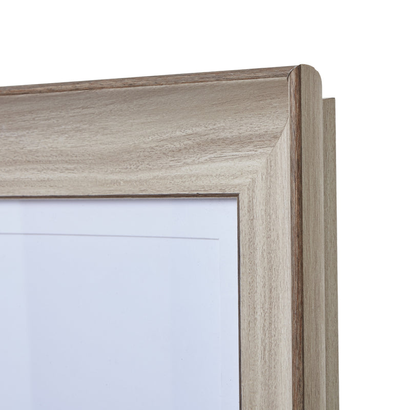 Close-up of the whitewashed stepped wooden moulding