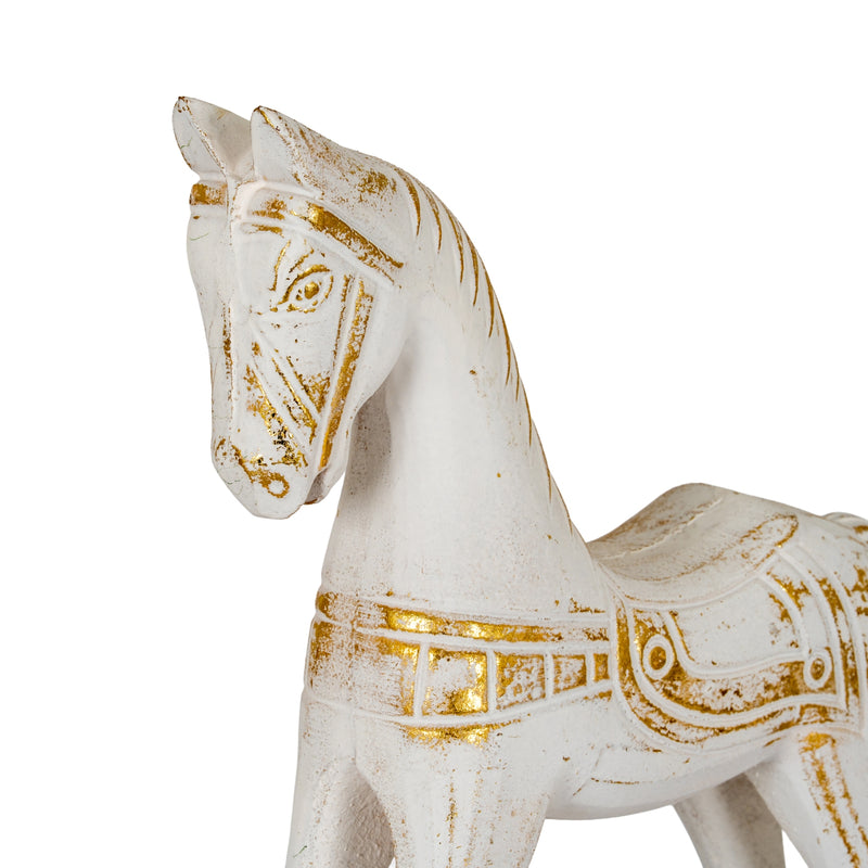 Close-up of the gold-painted bridle and saddle detail