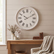 Whitewashed Wooden Wall Clock with Black Numerals – 60cm, wall clock hung above a wooden console table