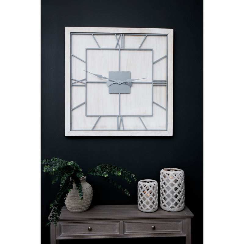 White square clock on a dark wall above a sideboard