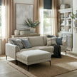 Zephra sofa and footstool in a living room with blue cushions and a jute rug