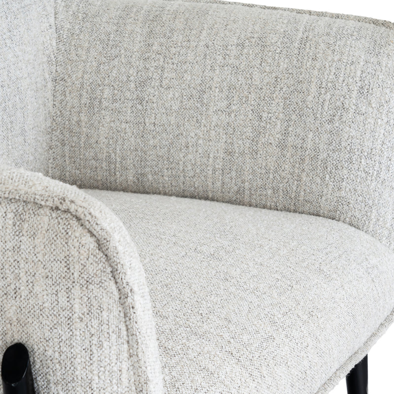 close-up of the curved arm and textured fabric