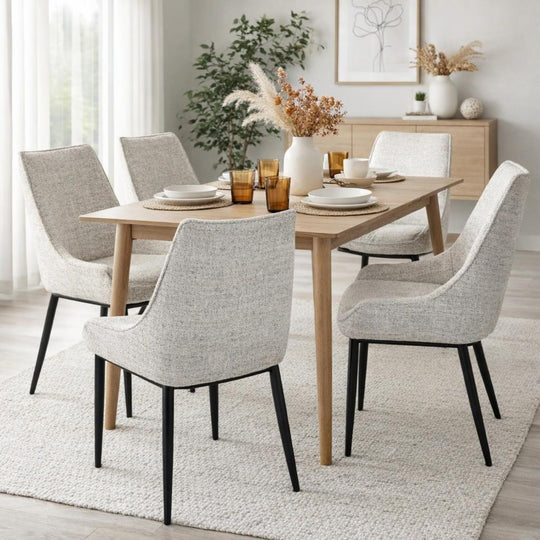 Zephra chairs around a wooden dining table in a bright room