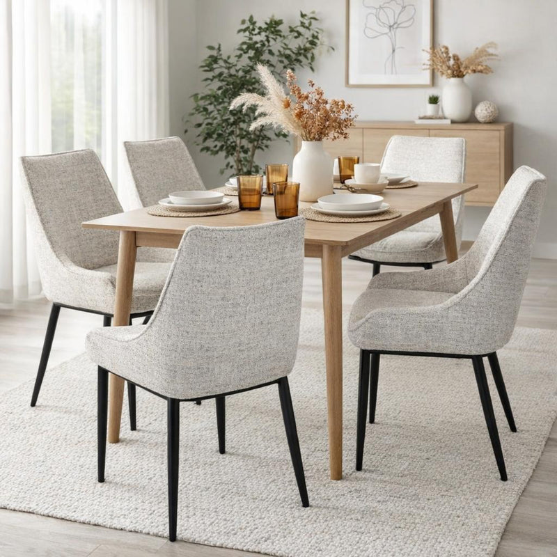 Zephra chairs around a wooden dining table in a bright room
